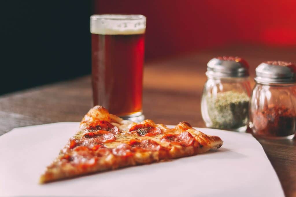 Why do Italians drink beer with pizza?